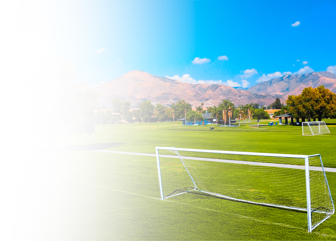 San Bernardino Soccer Complex natural grass fields with goal posts and mountain views.